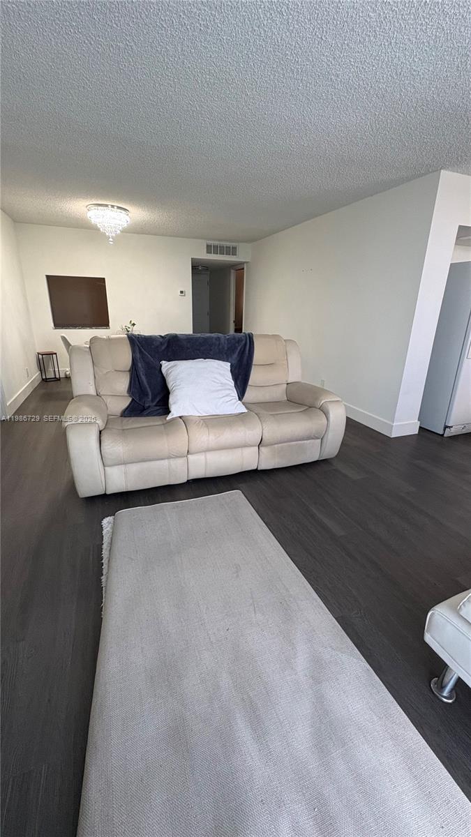 299 Northwest 52nd Terrace, Unit PHX Boca Raton, FL 33487 - Photo 22 of 29 a close view of light fixtures and wooden floor