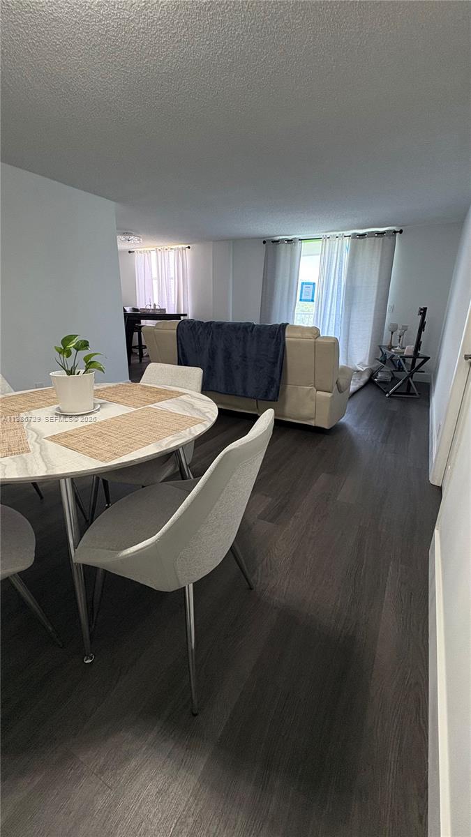 299 Northwest 52nd Terrace, Unit PHX Boca Raton, FL 33487 - Photo 25 of 29 a dining room with furniture and window