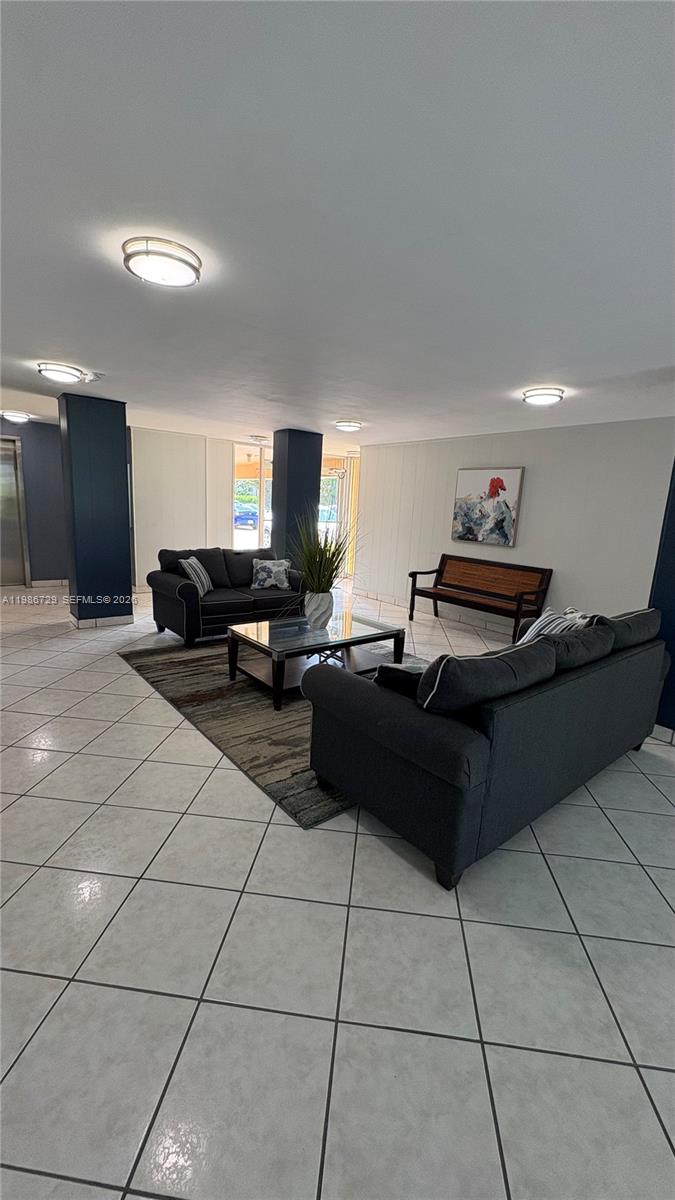 299 Northwest 52nd Terrace, Unit PHX Boca Raton, FL 33487 - Photo 27 of 29 a living room with furniture