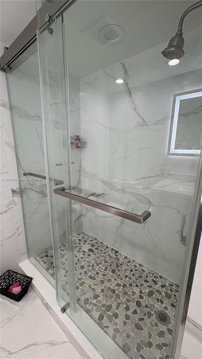 299 Northwest 52nd Terrace, Unit PHX Boca Raton, FL 33487 - Photo 7 of 29 a bathroom with a shower
