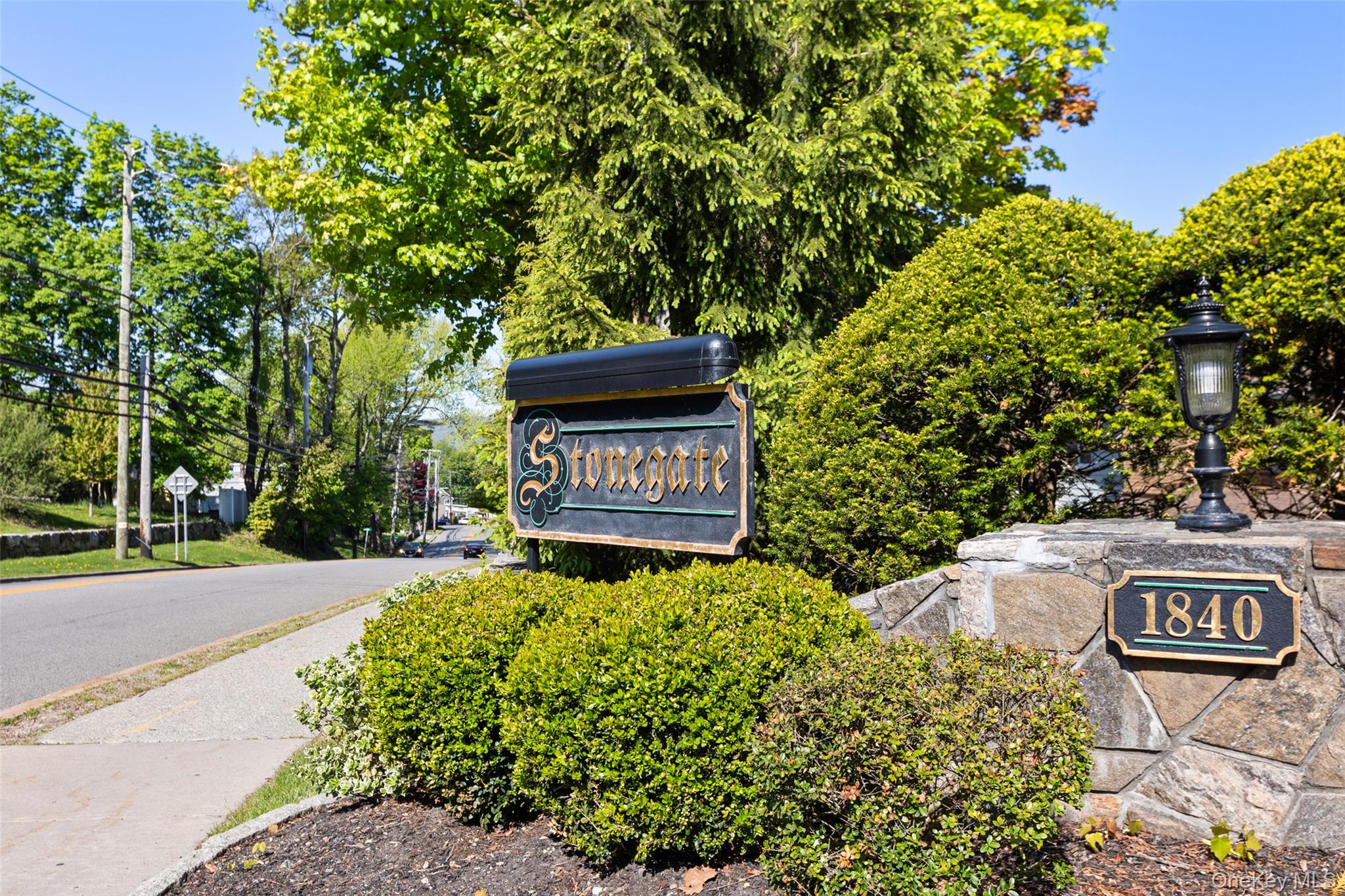 1840 Crompond Road, Unit 5C2 Peekskill, NY 10566 - Photo 27 of 27 a sign that is sitting in front of a tree