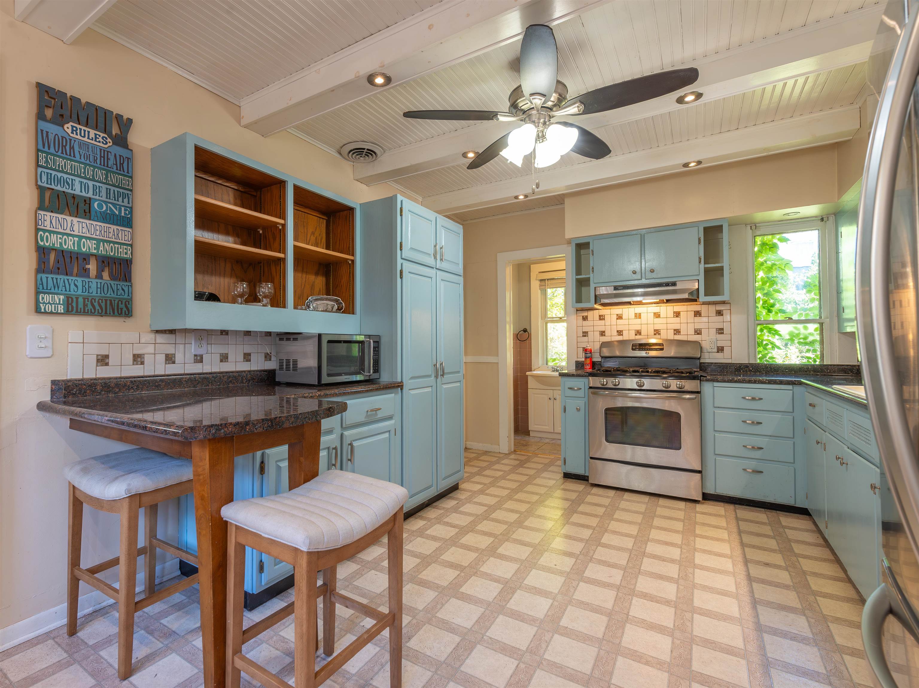 933 West Stephenson Street Freeport, IL 61032 - Photo 11 of 32 a kitchen with stainless steel appliances granite countertop a stove a sink and a refrigerator