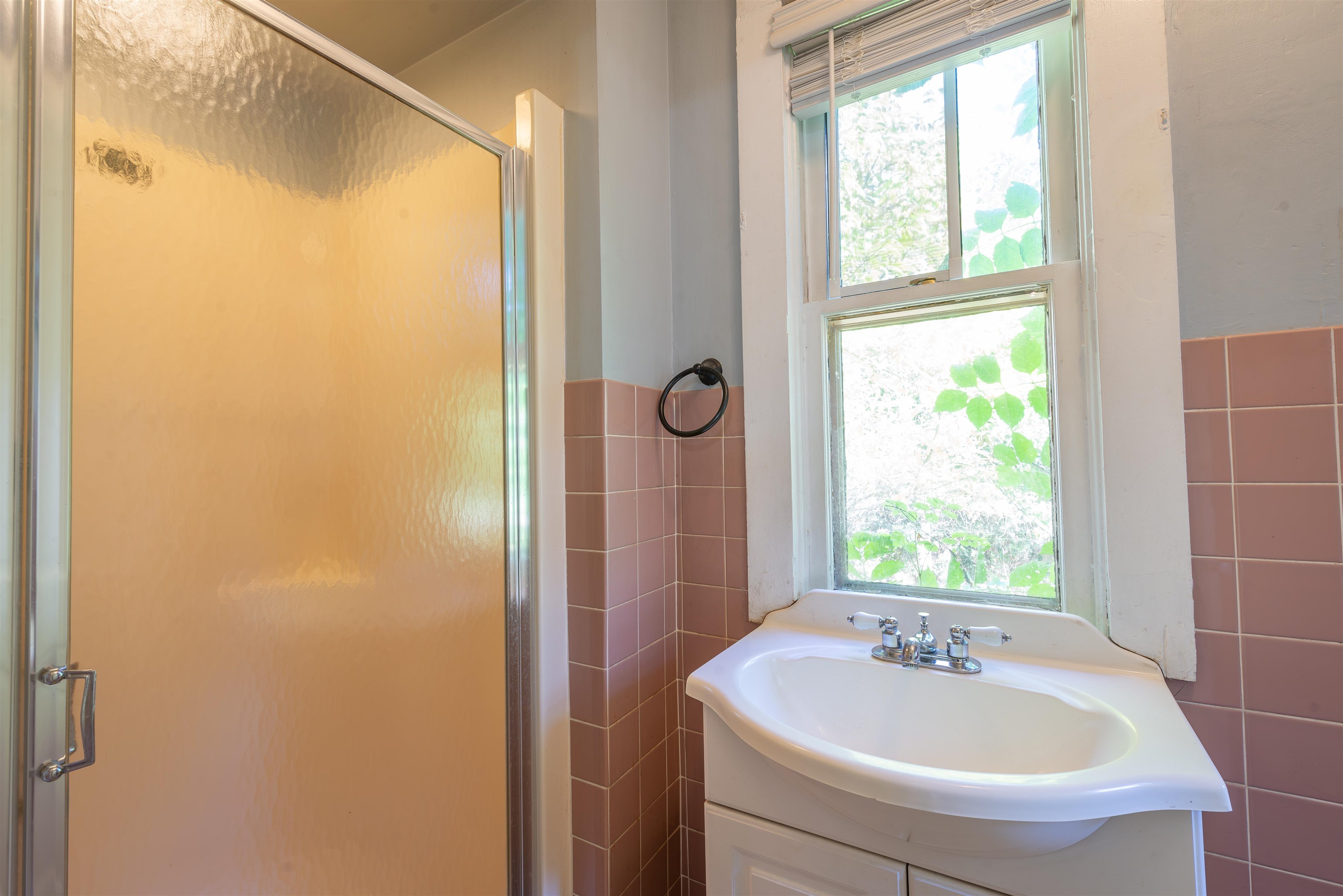 933 West Stephenson Street Freeport, IL 61032 - Photo 12 of 32 a bathroom with a sink and a window