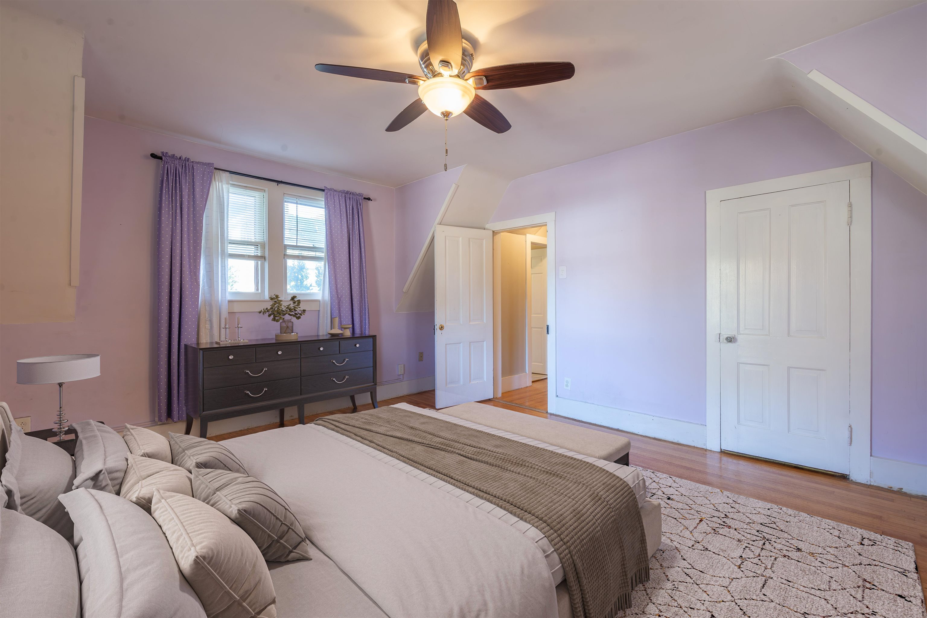933 West Stephenson Street Freeport, IL 61032 - Photo 21 of 32 a bedroom with a bed and a chandelier fan