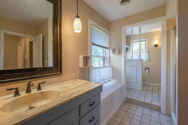 a bathroom with a sink and a mirror