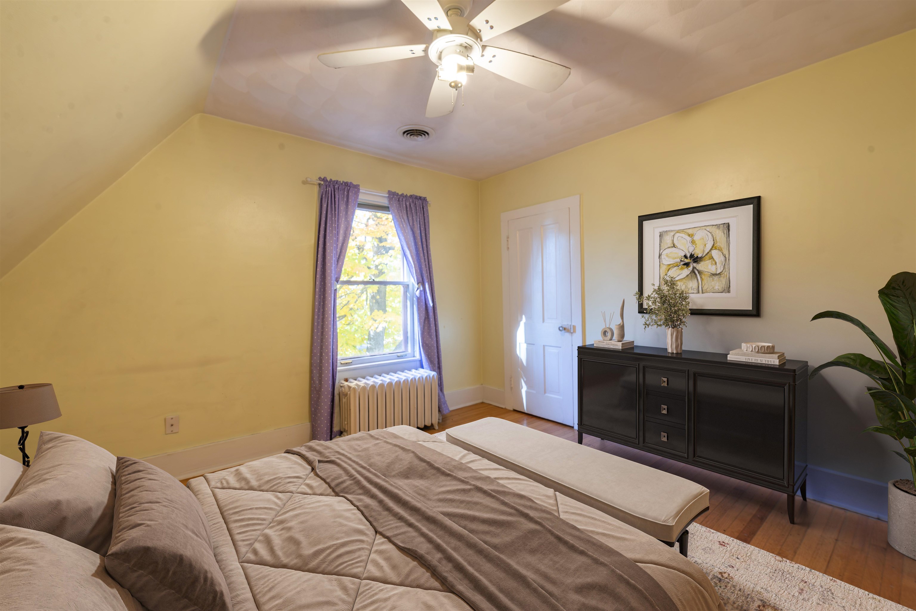 933 West Stephenson Street Freeport, IL 61032 - Photo 26 of 32 a bedroom with a bed and wooden floor