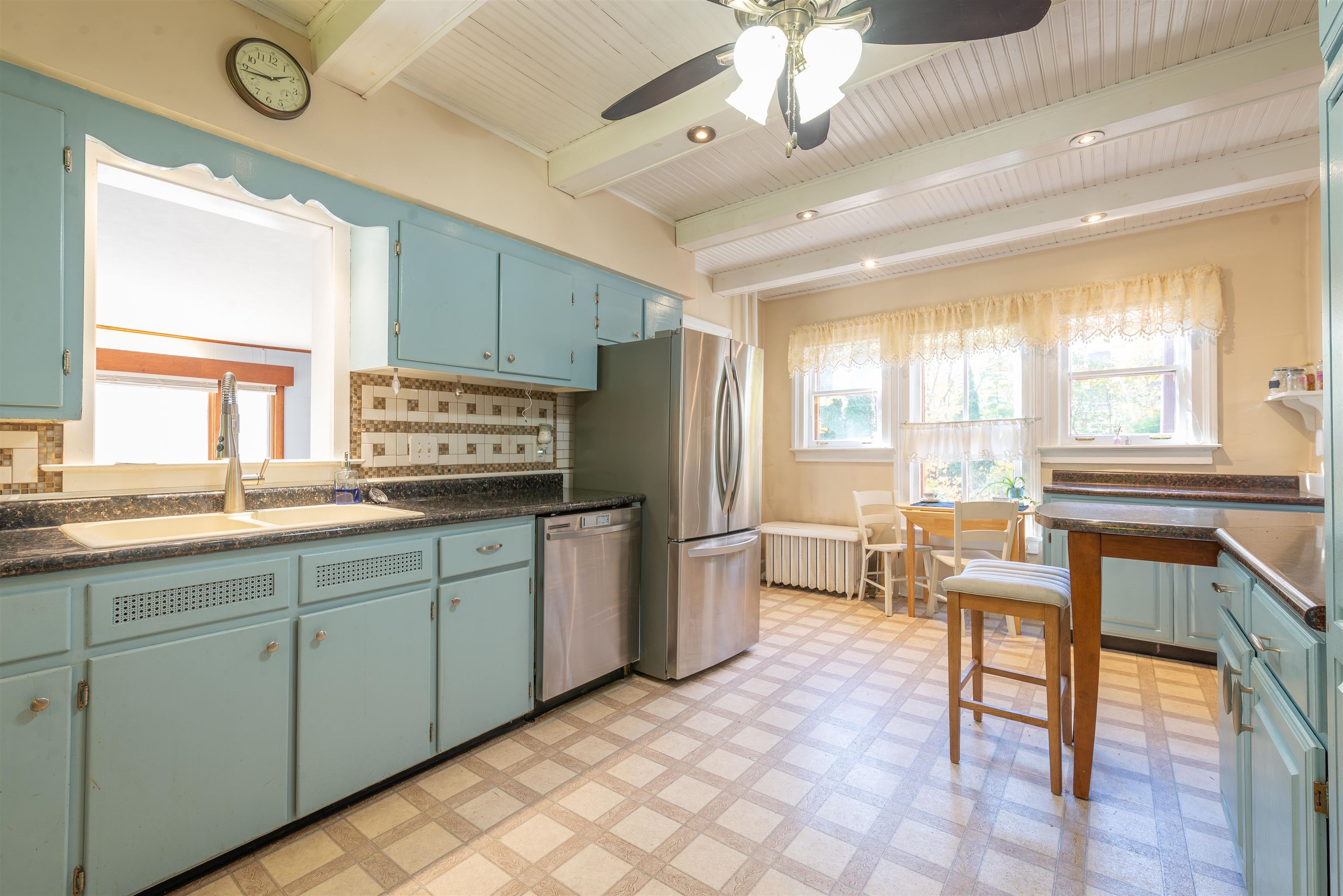 933 West Stephenson Street Freeport, IL 61032 - Photo 9 of 32 a kitchen with granite countertop cabinets a dining table and chairs