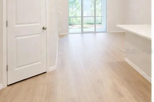 a kitchen with stainless steel appliances a refrigerator a stove a microwave and cabinets