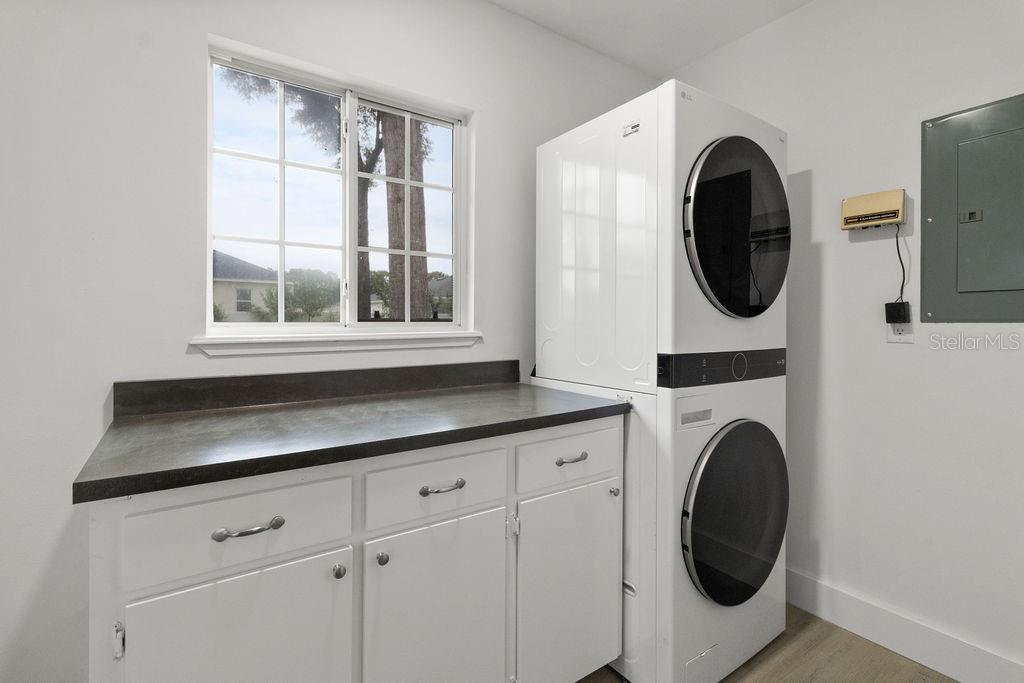 7579 Southwest 108th Place Ocala, FL 34476 - Photo 19 of 33 a view of a kitchen with washer and dryer