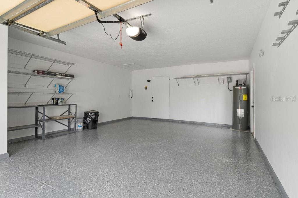 7579 Southwest 108th Place Ocala, FL 34476 - Photo 25 of 33 a view of a livingroom with a chair and white walls