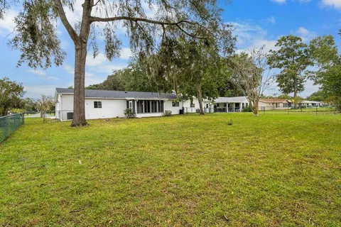 a view of a house with a big yard