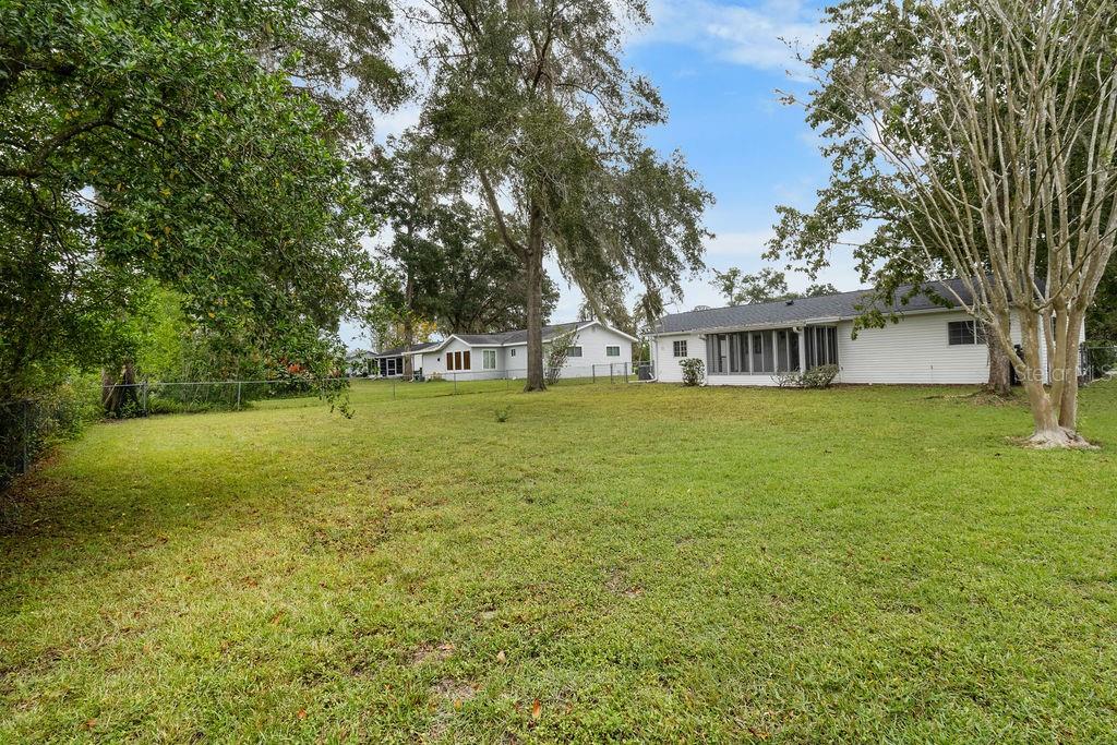7579 Southwest 108th Place Ocala, FL 34476 - Photo 28 of 33 a view of a house with yard and tree s