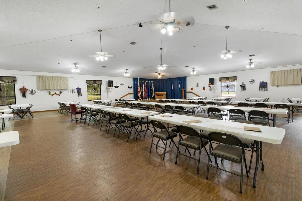 7579 Southwest 108th Place Ocala, FL 34476 - Photo 31 of 33 a kitchen with lots of wooden furniture appliances and a dining table