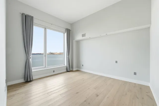 a view of an empty room with glass door