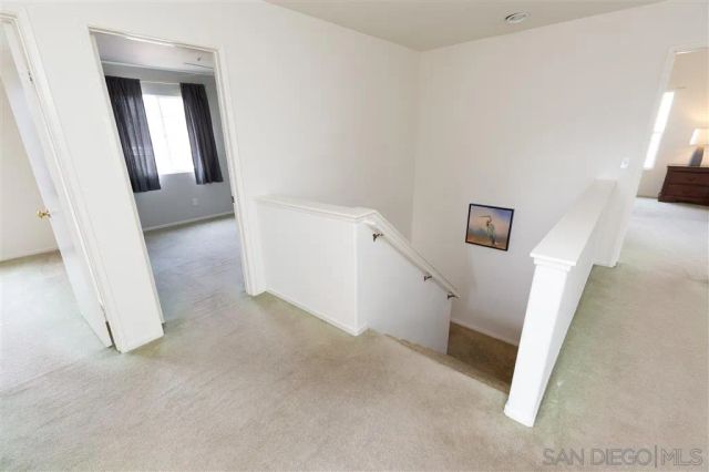 a view of a hallway with workspace