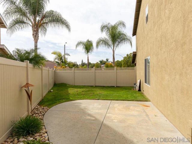 a view of a backyard with a garden and plants