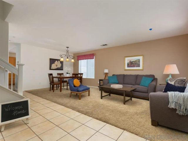 a living room with furniture and a couch