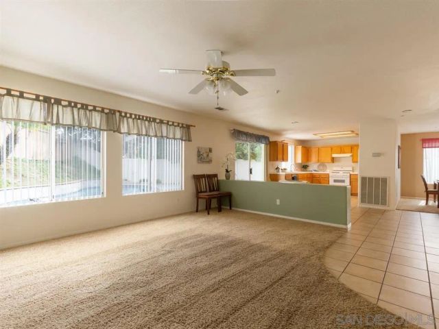 a view of a kitchen with furniture and a window
