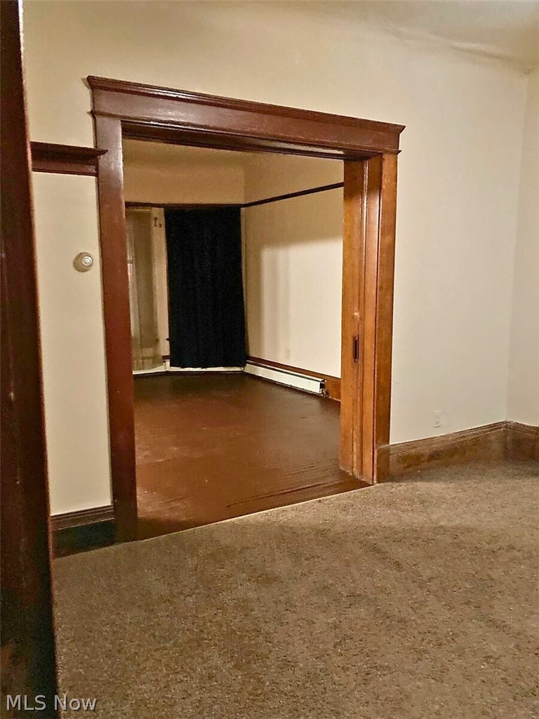 554 Eddy Road Cleveland, OH 44108 - Photo 27 of 32 1st Floor- Unfurnished room with baseboards and baseboard heating
