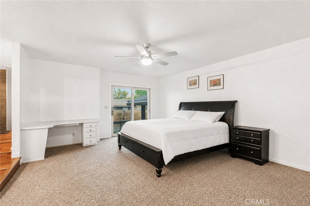 1908 Chelwood Way Modesto, CA 95355 - Photo 10 of 54 a spacious bedroom with a bed and a chandelier