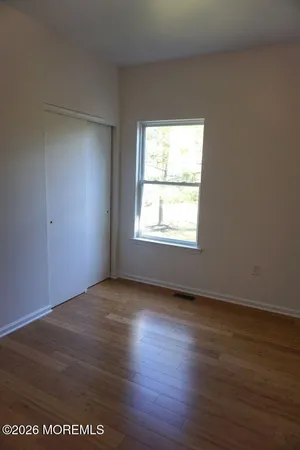a balcony with view of wooden floor