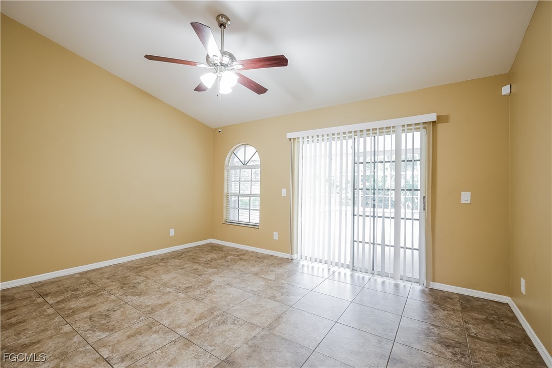 803 Hamilton Avenue Lehigh Acres, FL 33972 - Photo 4 of 16 a view of an empty room with a window