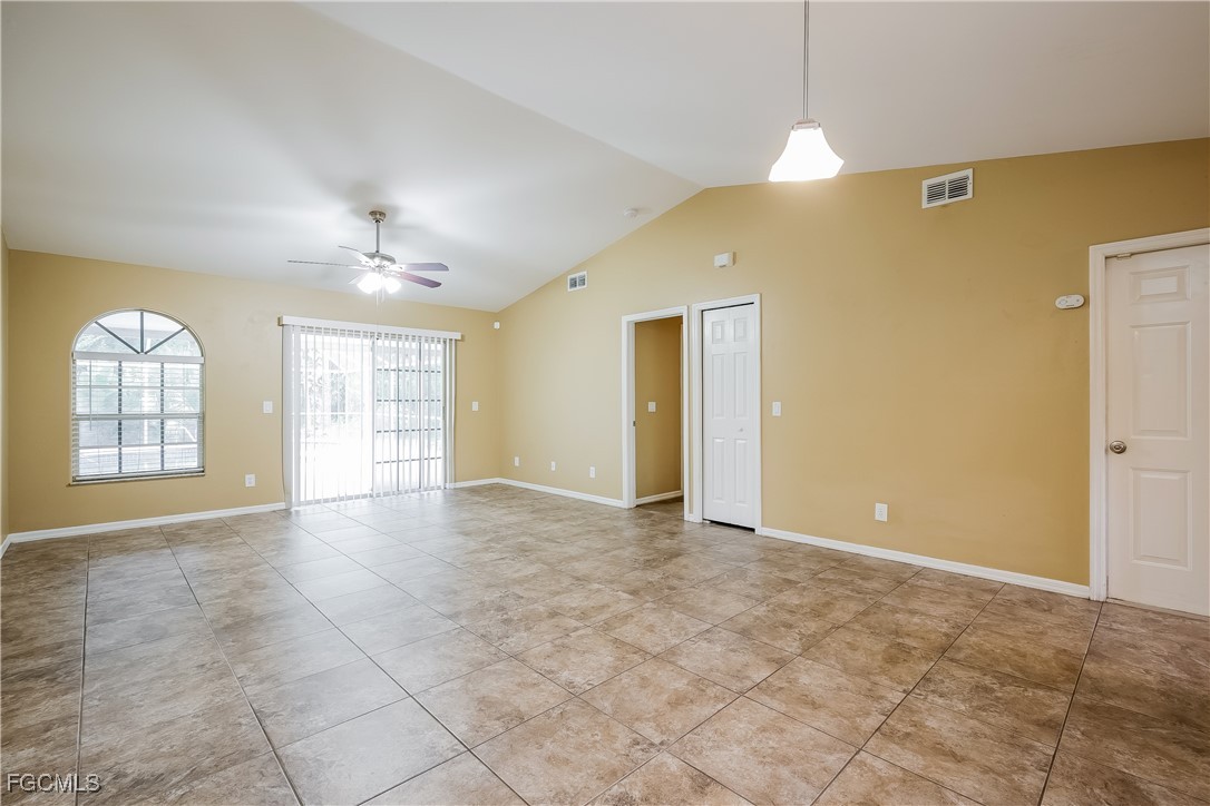 803 Hamilton Avenue Lehigh Acres, FL 33972 - Photo 6 of 16 a view of an empty room with a window