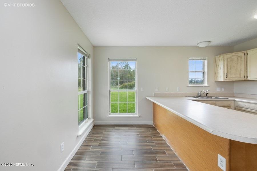 11101 Aaron Fish Road Glen St. Mary, FL 32040 - Photo 12 of 44 a view of a kitchen with a sink and windows