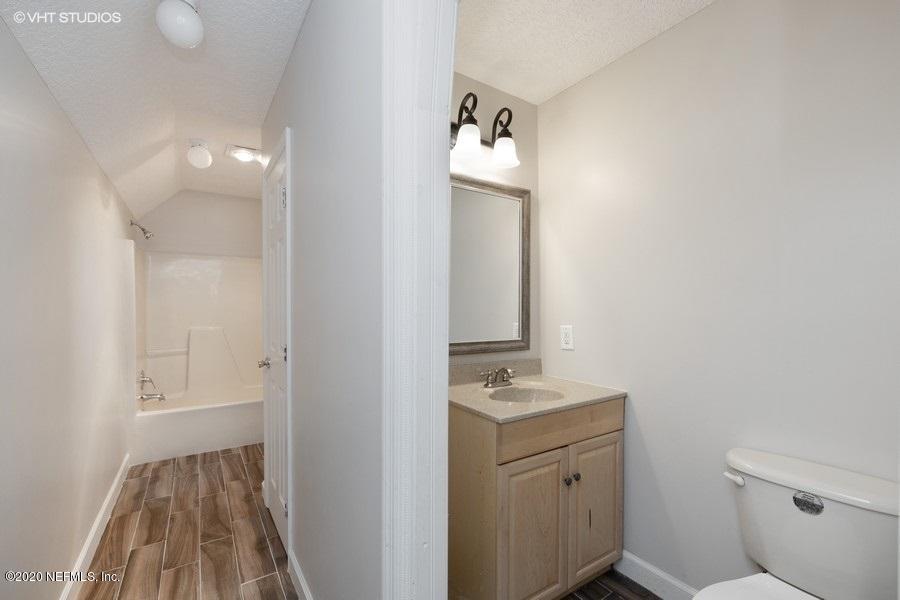 11101 Aaron Fish Road Glen St. Mary, FL 32040 - Photo 20 of 44 a bathroom with a sink a toilet and shower