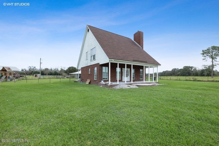 11101 Aaron Fish Road Glen St. Mary, FL 32040 - Photo 2 of 44 a front view of a house with garden