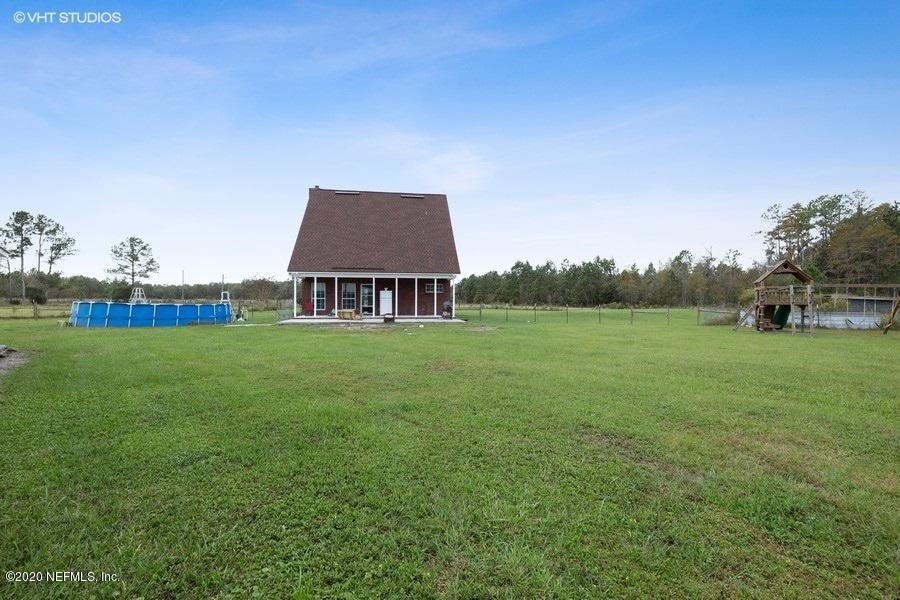 11101 Aaron Fish Road Glen St. Mary, FL 32040 - Photo 24 of 44 a front view of house with garden