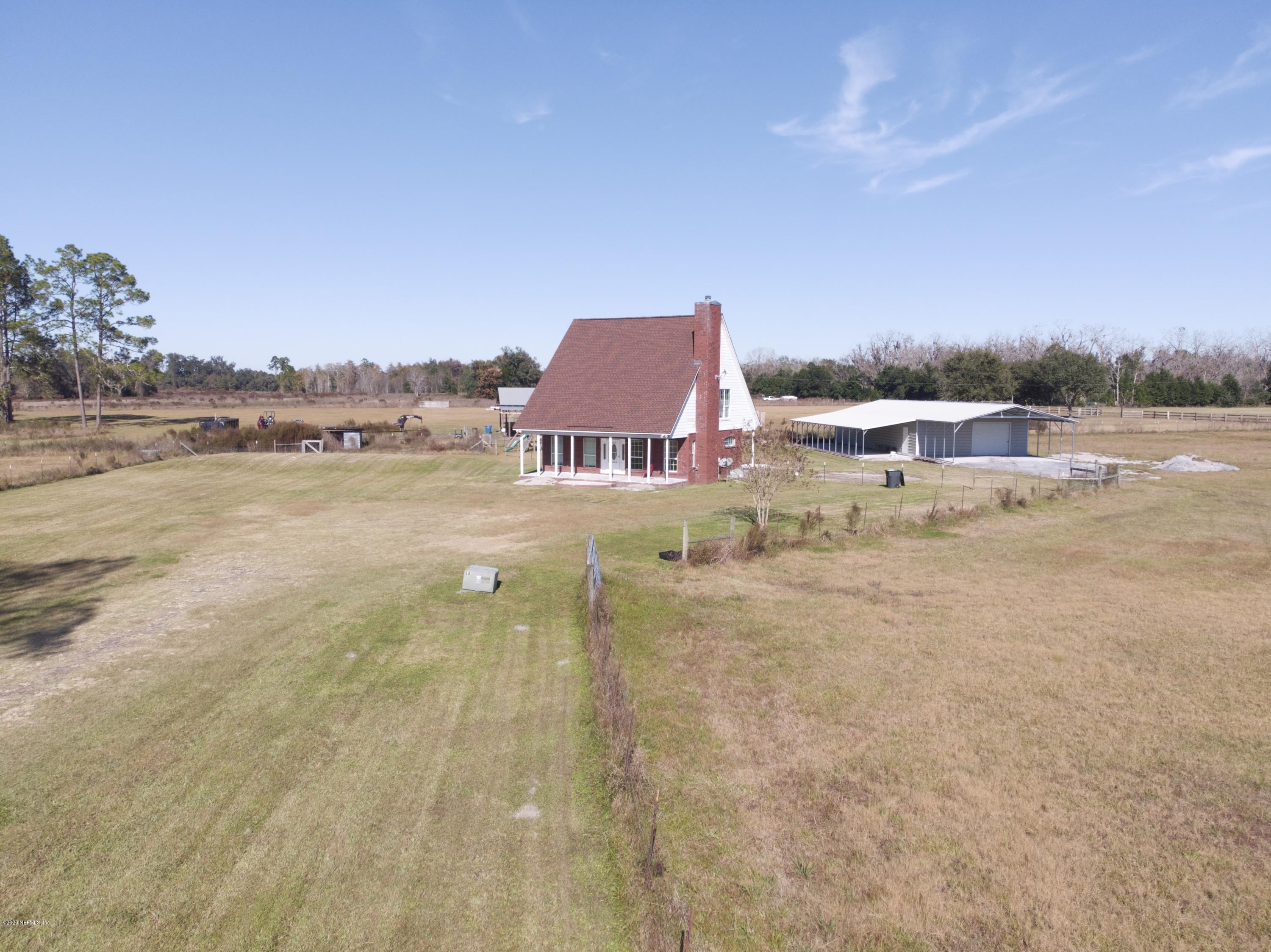 11101 Aaron Fish Road Glen St. Mary, FL 32040 - Photo 29 of 44 a view of swimming pool and lake in back