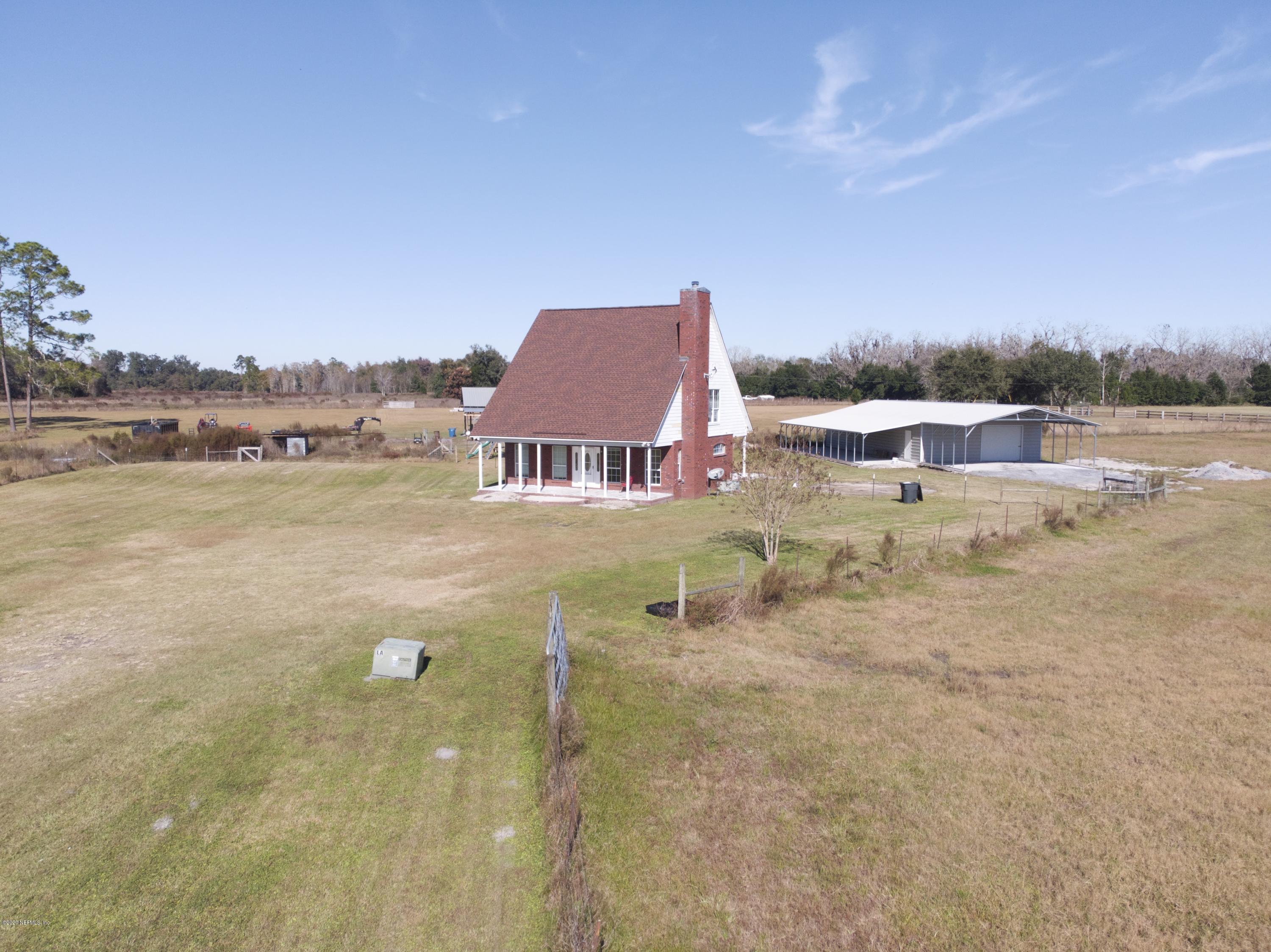 11101 Aaron Fish Road Glen St. Mary, FL 32040 - Photo 30 of 44 a view of a lake with houses with outdoor space