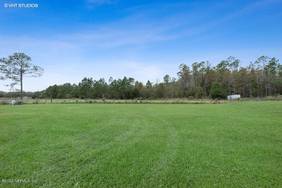 11101 Aaron Fish Road Glen St. Mary, FL 32040 - Photo 3 of 44 a view of field with trees in the background