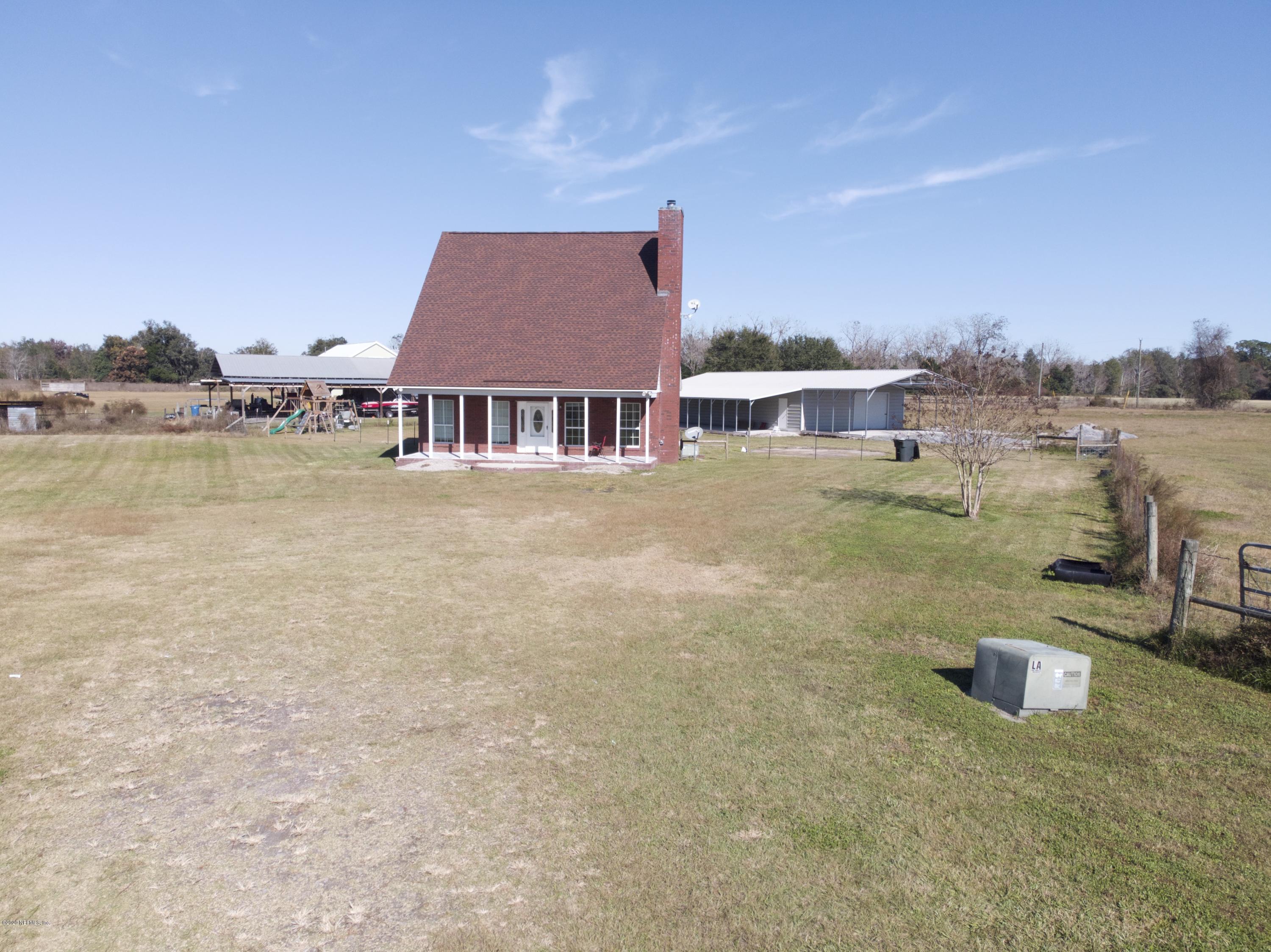 11101 Aaron Fish Road Glen St. Mary, FL 32040 - Photo 32 of 44 an aerial view of residential houses with outdoor space and ocean view