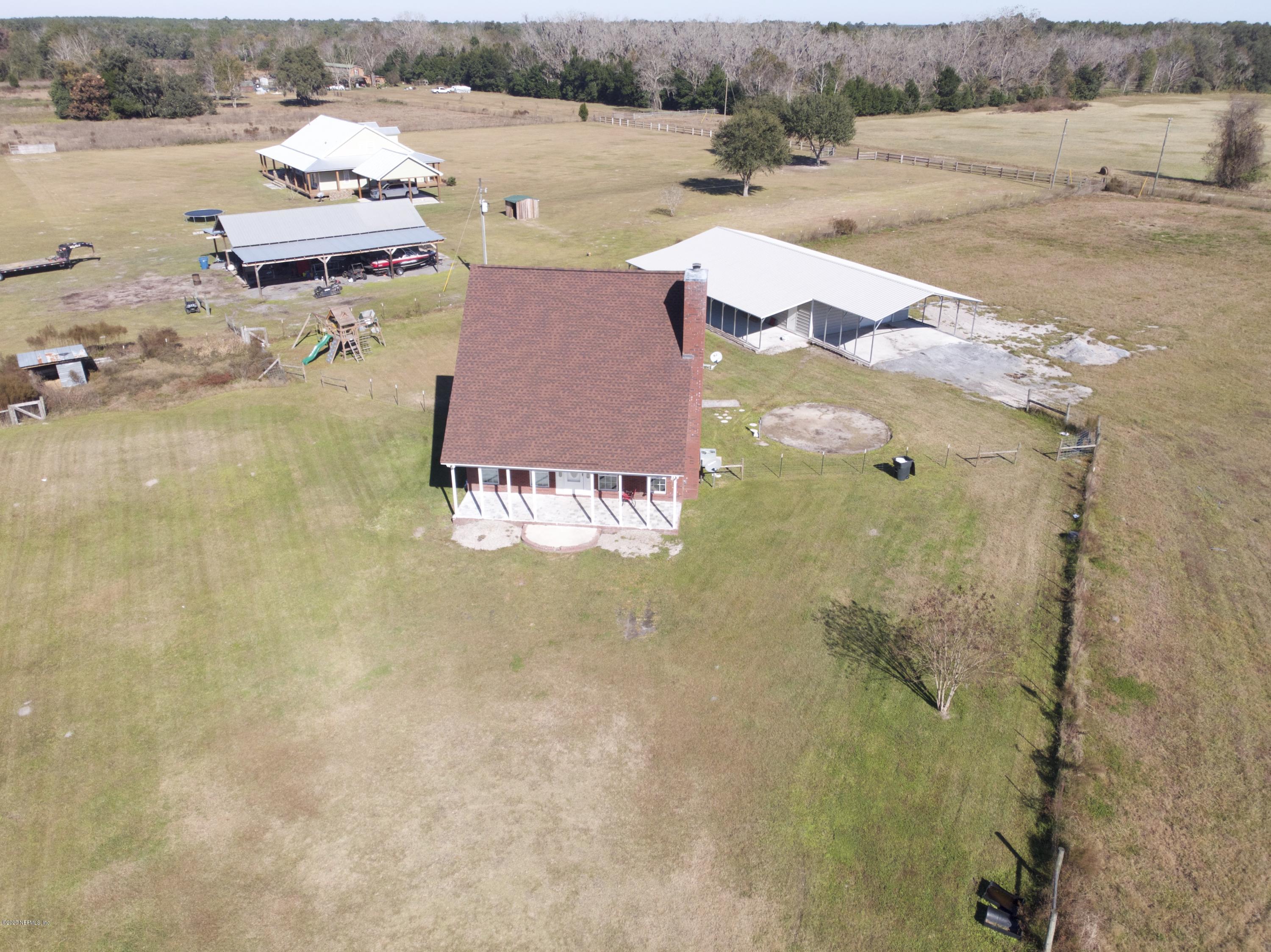 11101 Aaron Fish Road Glen St. Mary, FL 32040 - Photo 34 of 44 an aerial view of a house with outdoor space and lake view