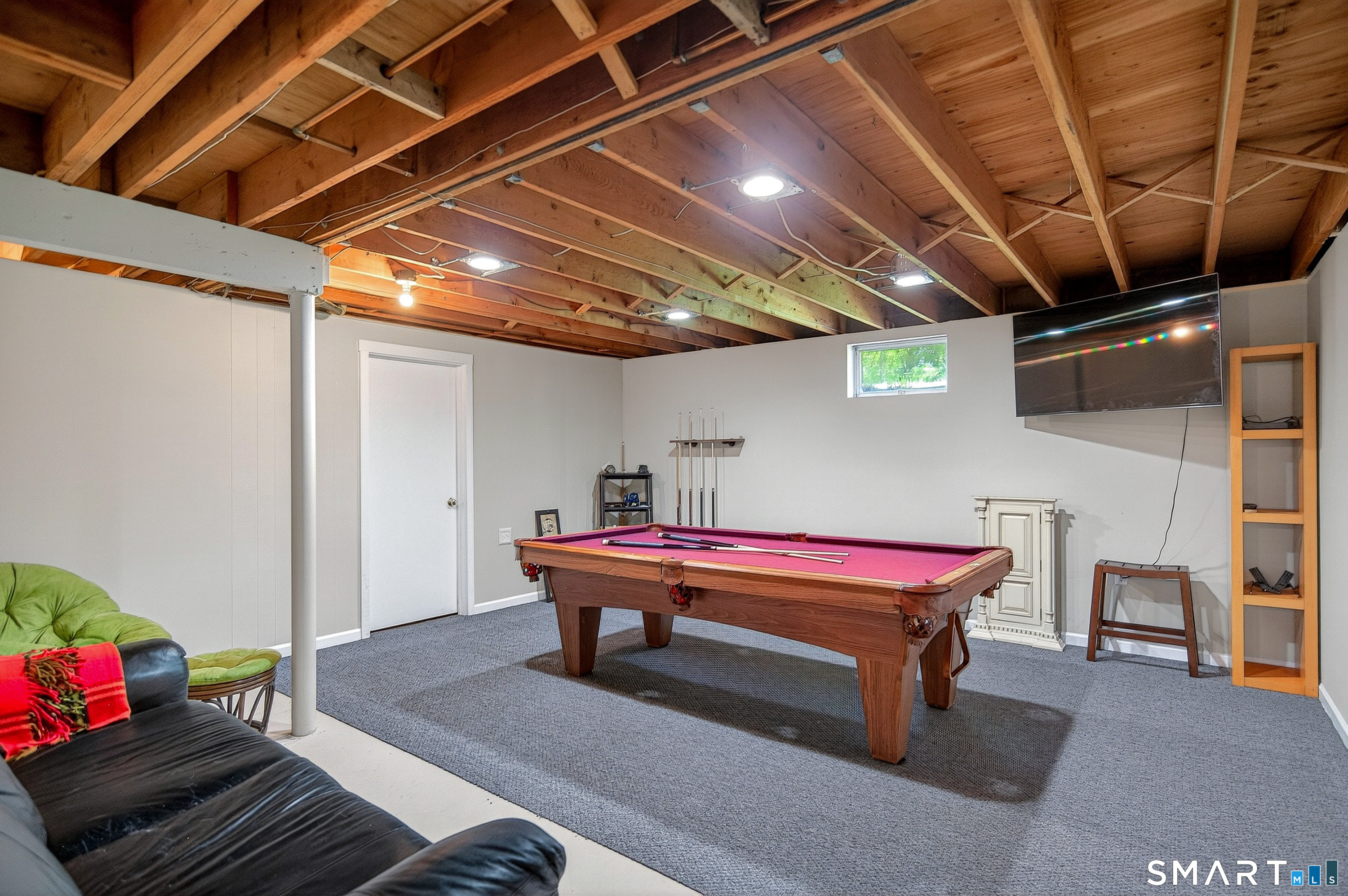 174 Huntingtown Road Newtown, CT 06470 - Photo 29 of 40 a room with wooden furniture and gym equipment