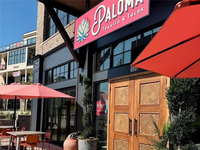 a sign on the side of a street