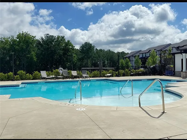 a aerial view of a house with a swimming pool