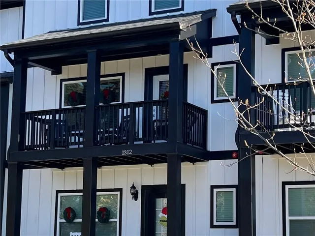 a front view of a houses on the street