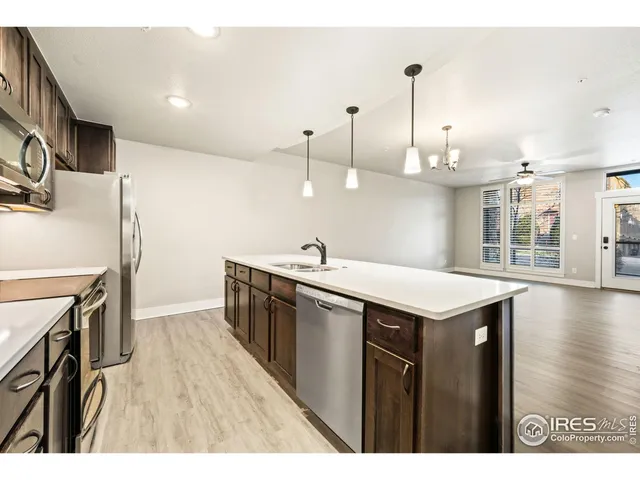 a kitchen with a sink and stove