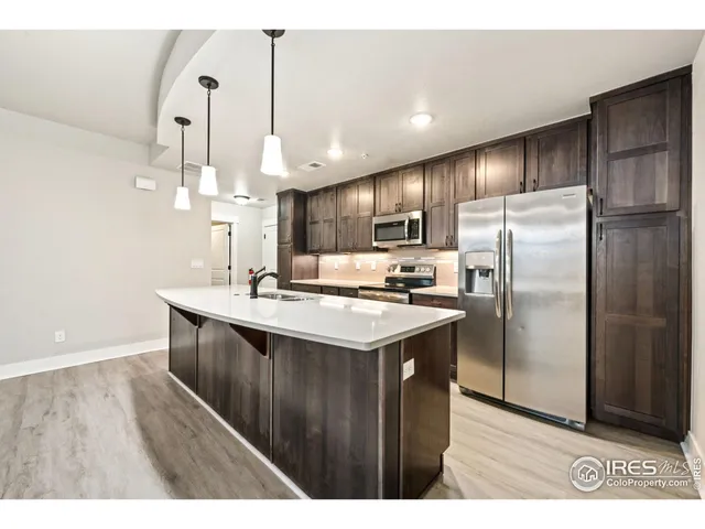 a view of kitchen with wooden floor