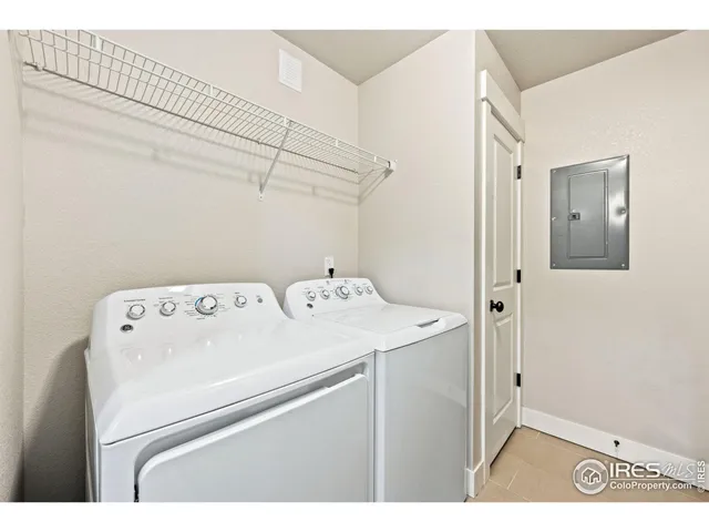 a view of kitchen with refrigerator microwave and wooden floor