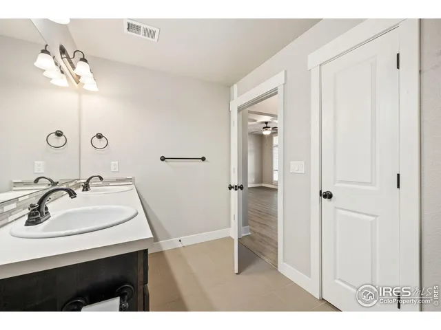 a view of a bathroom with mirror