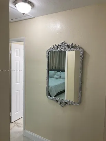 an empty room with a mirror
