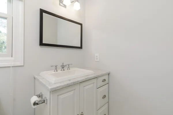 a bathroom with a sink and a mirror