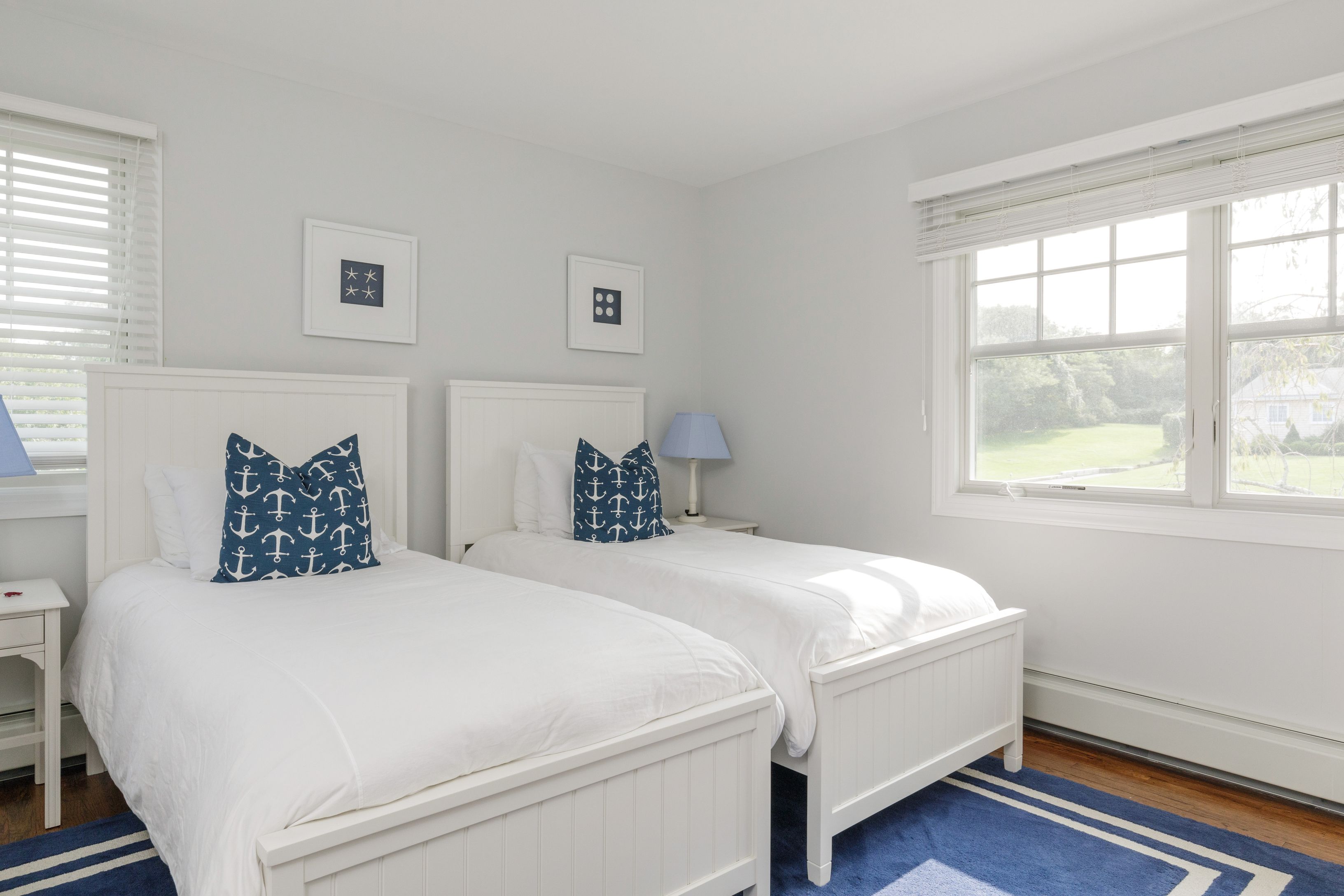 Undisclosed Address Southampton, NY 11968 - Photo 14 of 25 a bedroom with a bed and a window