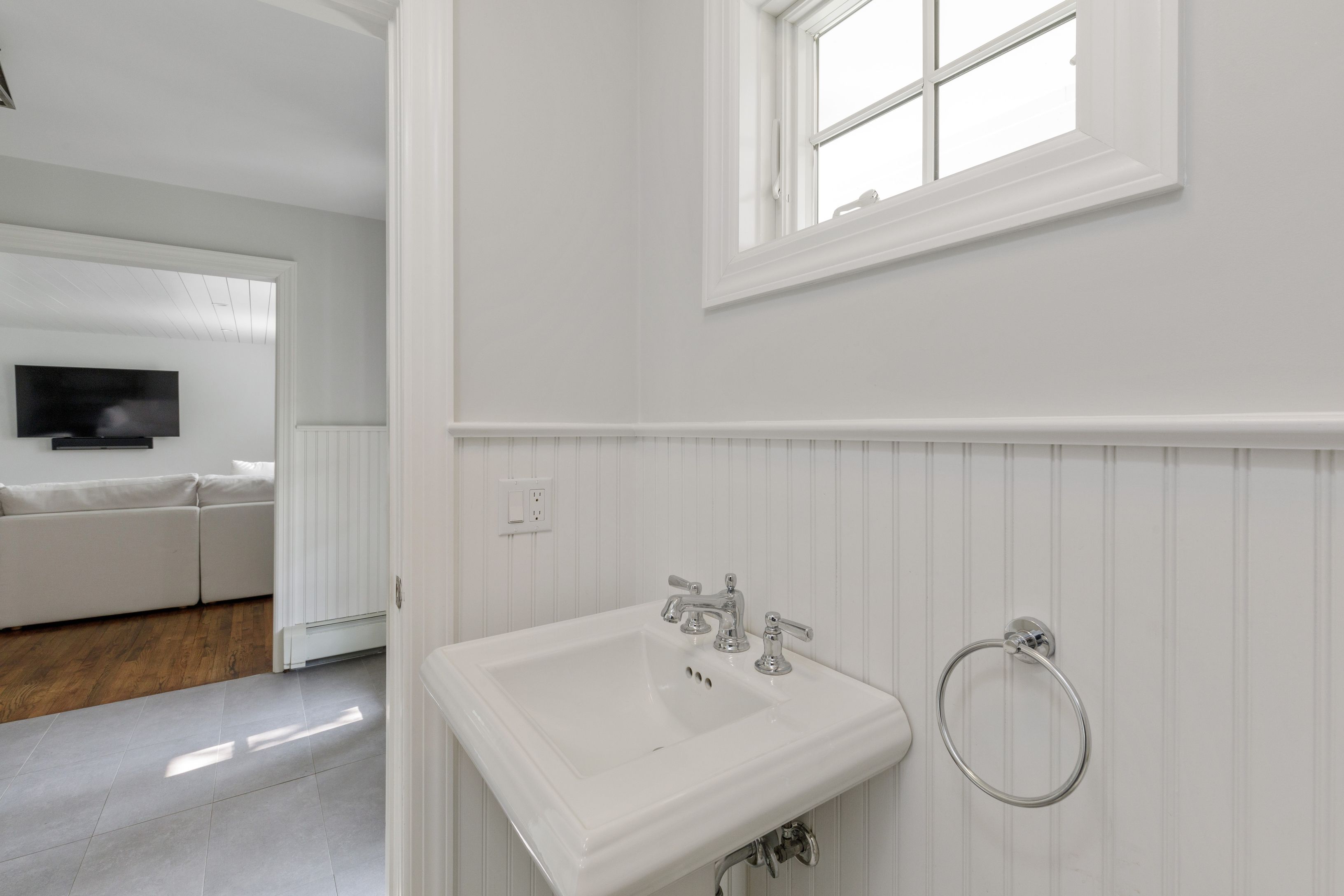 Undisclosed Address Southampton, NY 11968 - Photo 15 of 25 a bathroom with a sink and a mirror