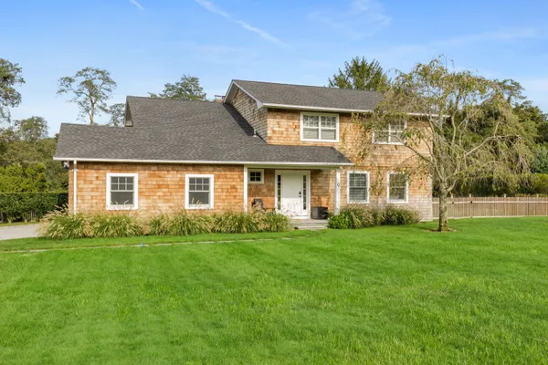 front view of a house with a yard