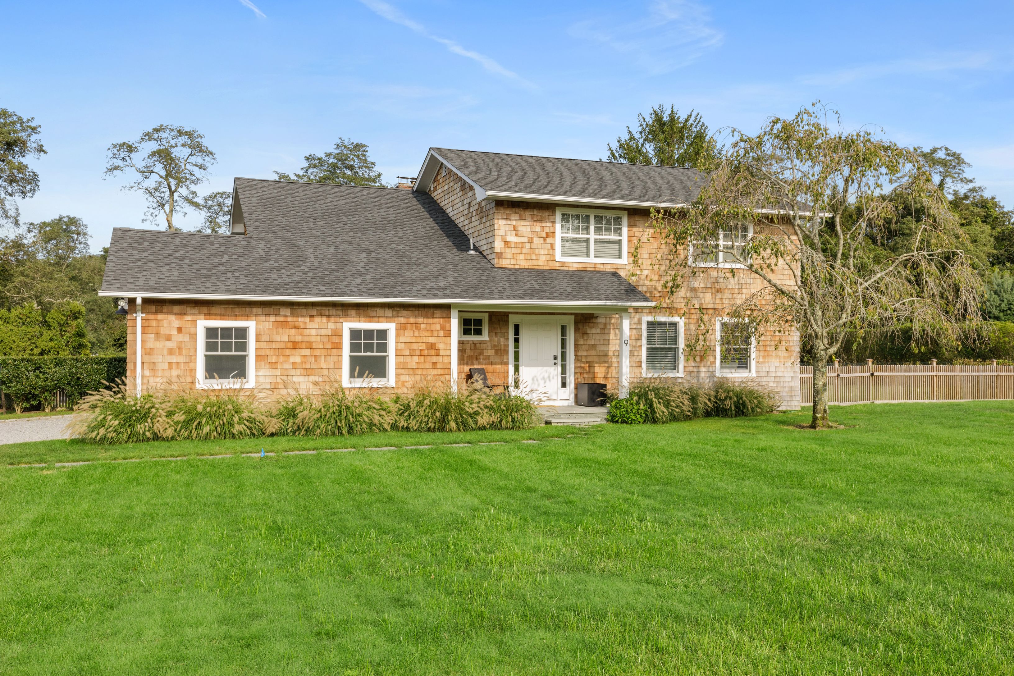 Undisclosed Address Southampton, NY 11968 - Photo 25 of 25 front view of a house with a yard